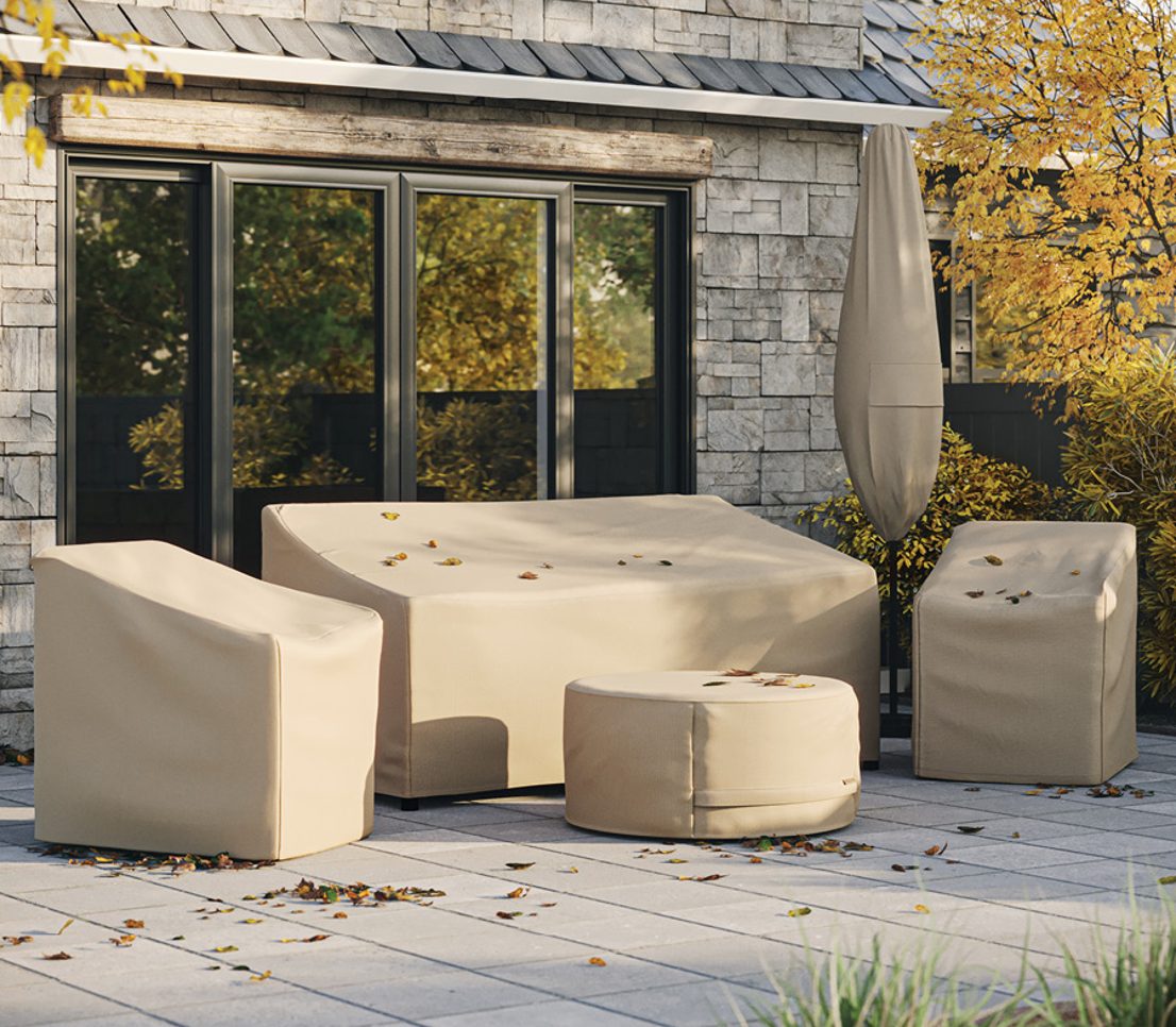 Coverstore protective covers on outdoor patio furniture at golden hour