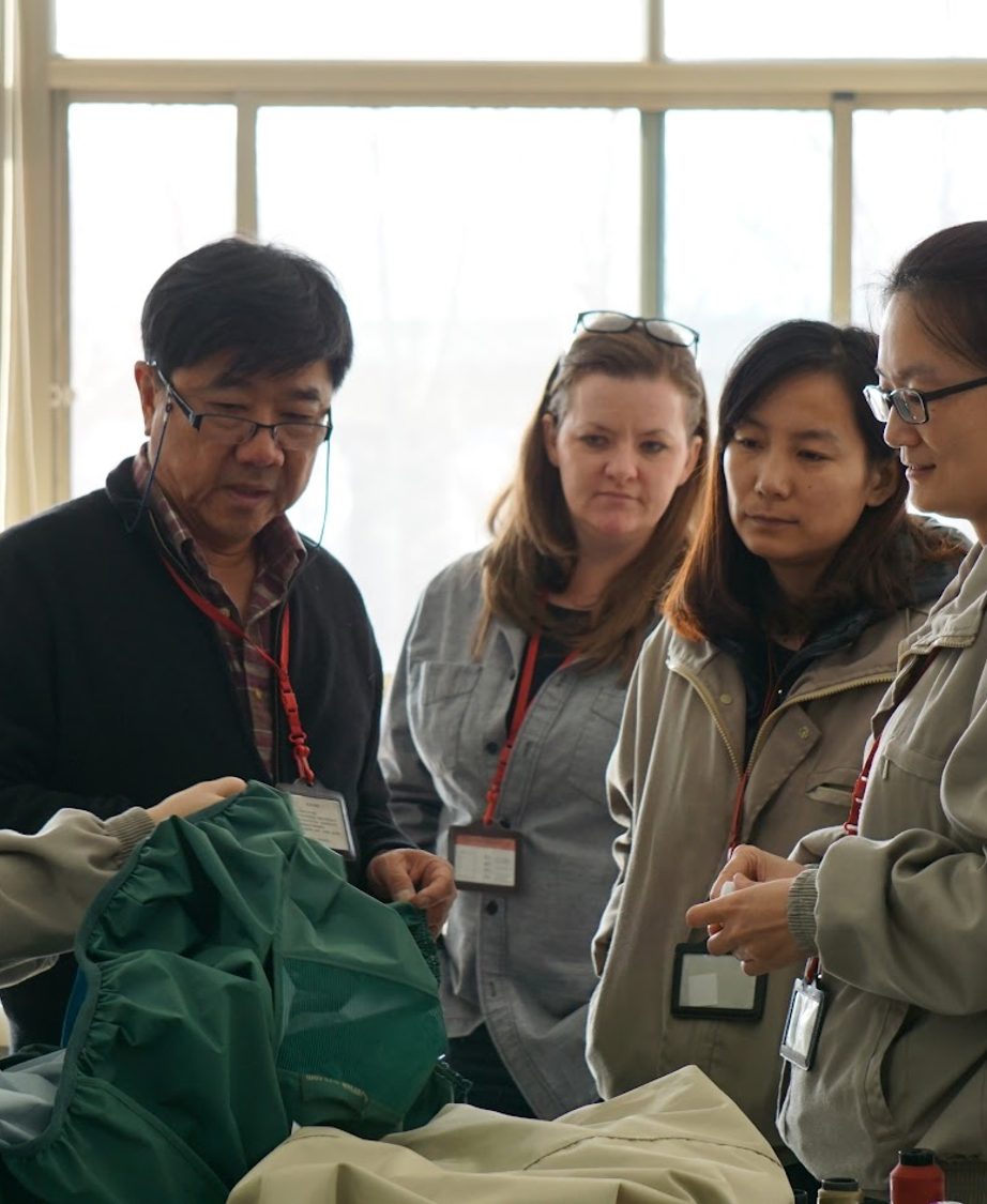 DCI team reviewing a product together at the factory